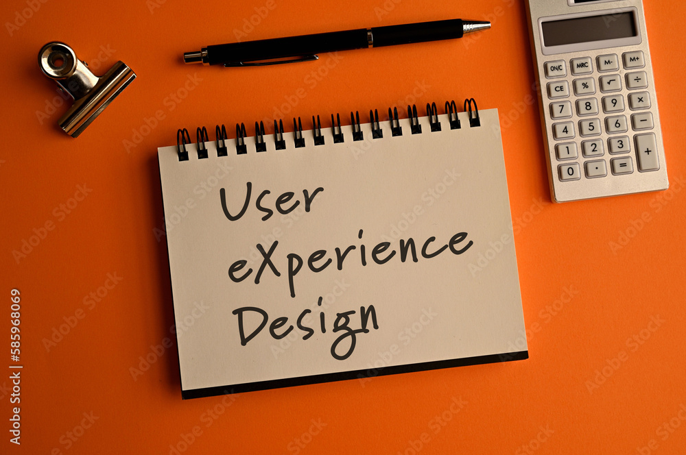 Poster there is a notebook with the word user experience design. it is eye-catching image.