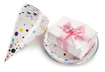 Party hats with gift box and plates on white background