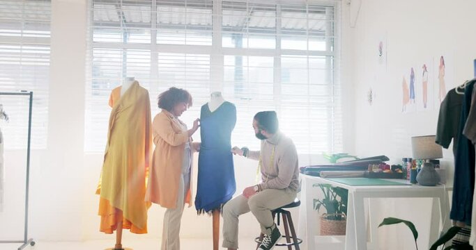 Fashion, man and woman with clothes, workplace and check measurements before runway show. Young people, stylist and dress in studio, texture or tailor sewing material, fabric or mannequin for styling