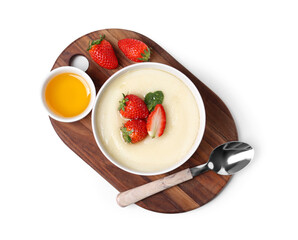 Bowl of tasty semolina porridge with strawberry and honey on white background