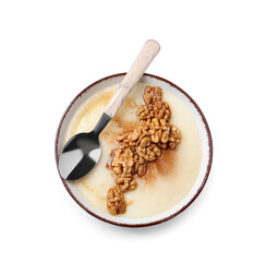 Bowl of tasty semolina porridge with nuts on white background