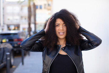 african american pretty woman feeling stressed, worried, anxious or scared, with hands on head,...