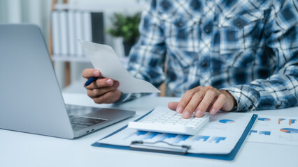 Personal bookkeeping for household expenses calculating with calculator.