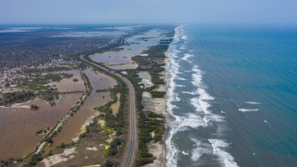 aerial view of beach with a nearly road