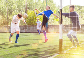 Football game - striker scores a goal with his head