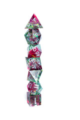 Magenta and green dice set stacked in a tower, white background