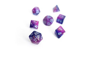 Purple and pink dice set with silver ink, white background