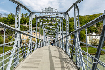 View at bridge Mozartsteg, an historical art nouveau pedestrian bridge in Salzburg city, austria,...