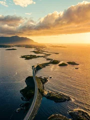 Photo sur Plexiglas Atlantic Ocean Road Breathtaking aerial view of the Atlantic Ocean Road during sunset with the sky painted orange