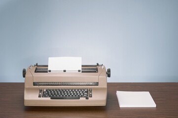 Close-up shot of a vintage typewriter on a wooden table