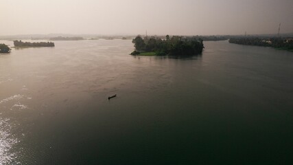 Aerial view of a boat on the sea with small islands.