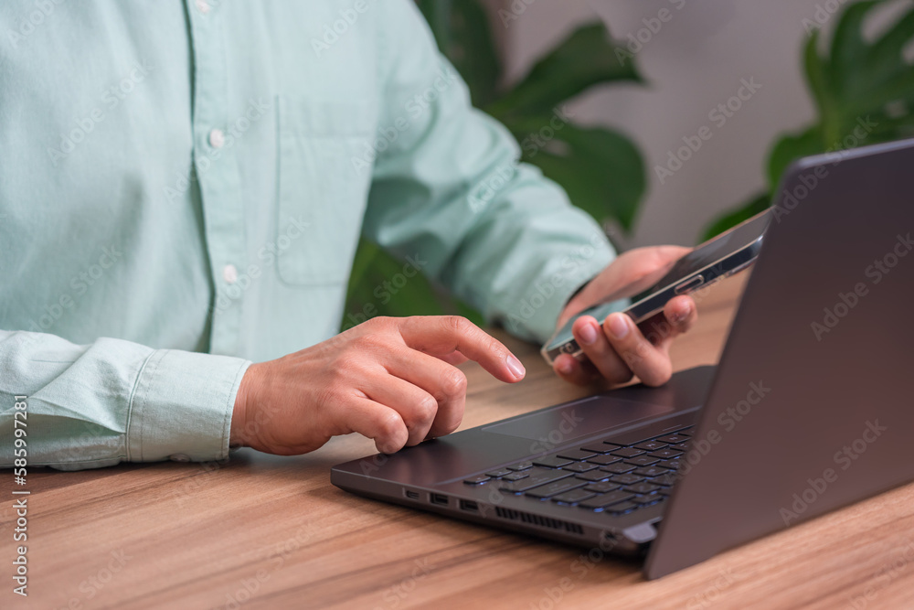 Poster Man using smartphone for purchasing and shopping online on computer. Mobile payment with wallet app technology. Digital money transfer, internet banking and e commerce concept.