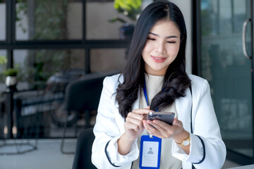 Business woman bookkeeper's hand use smartphones doing account for paying taxes in the working office