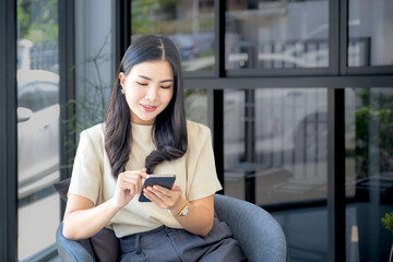 Business woman bookkeeper's hand use smartphones doing account for paying taxes in the working office