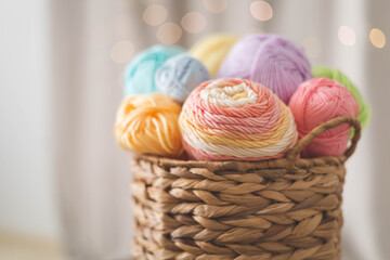 Cozy homely atmosphere. Female hobby knitting. Yarn pastel multicolor in a basket. Skeins and balls.