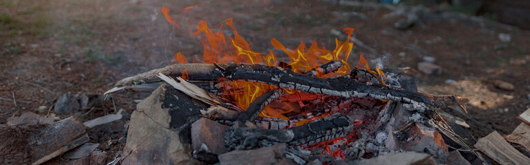 Close up of fire place in camping site on top pf mountain. Beautiful view. Bonfire concept.