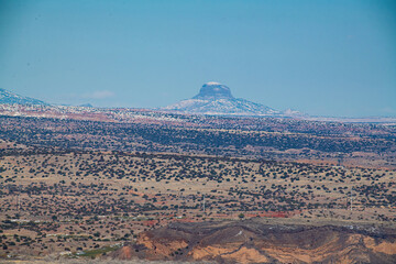 Snow covered butte on horizon