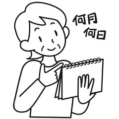 カレンダーで日付を確認するシニア女性