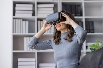 Surprised Young latin woman in VR headset touching air, Smiling white woman wearing vr glasses while sitting on sofa at home.