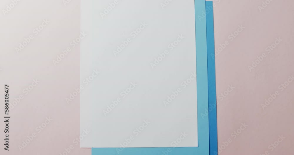 Poster close up of blank card on white background with copy space in slow motion