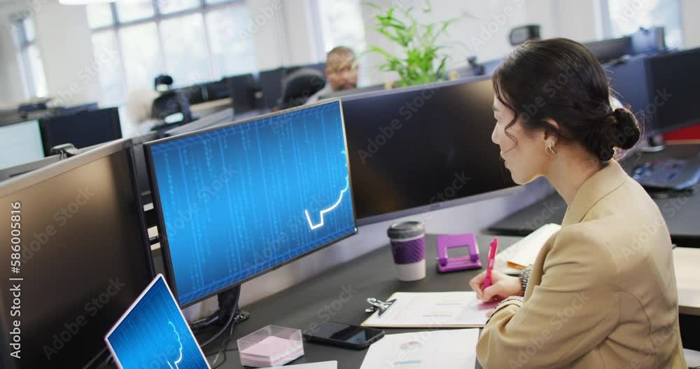Poster biracial businesswoman using computers with data processing in office