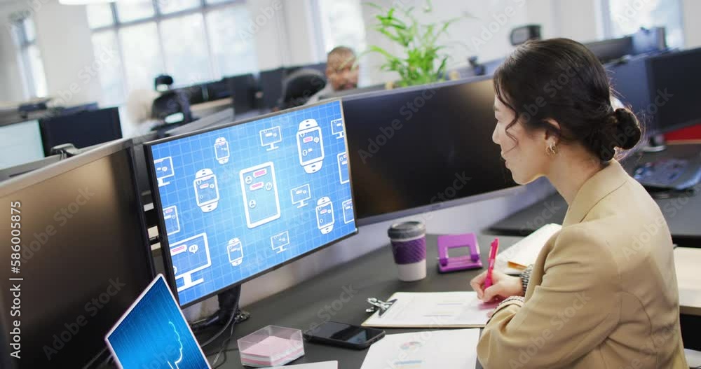 Poster asian businesswoman in office using computer with data processing on screen
