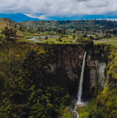 sipiso piso waterfall in the indonesia with backgrounds of mountains