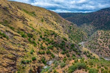 Barren valley surrounding confluence of Huebra and Camaces rivers in Spain