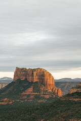 Naklejka na ściany i meble Capital Butte Rock lit up at sunset as seen from Cathedral Rock in Sedona.
