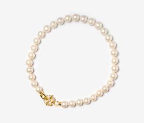 Freshwater pearl bracelet with gold hook and diamonds on white background. Collection of luxury jewelry accessories. Studio shot