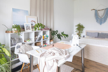Modern workplace of tailor textile craft designer table with sewing machine