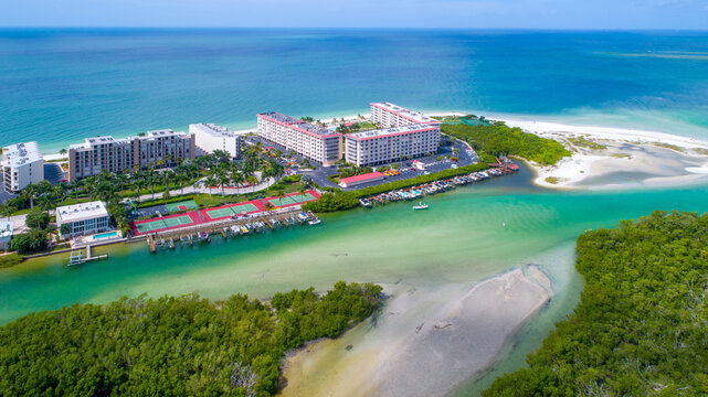 Drone Aerial Perspective of Little Hickory Island in Bonita Springs, Florida with Bay Water with Real Estate in the Foreground and the Calm Gulf of Mexico in the Background