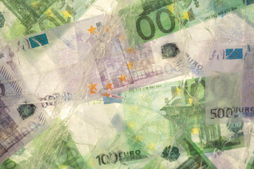 Blurred photo of one hundred and five hundred euros are defrosted in ice. The European cash currency is frozen.