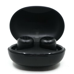 black wireless noise cancelling earbuds head set with a charging power bank case isolated in a white background