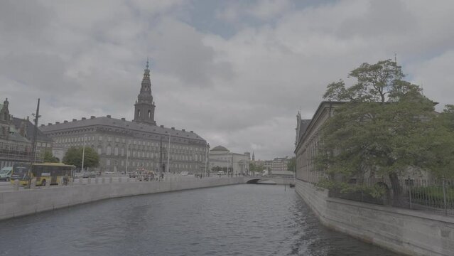 Shot across the river of Christiansborg Palace on a cloudy day LOG