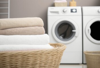 stack of towels in a basket in the laundry room