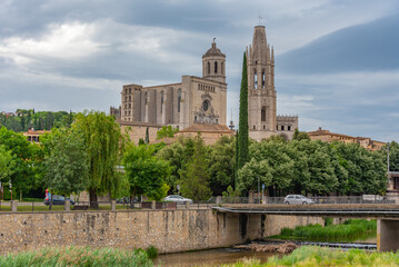 Girona cathedral viewed behind a river, Spain