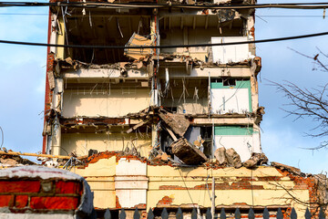 dismantled old building. Half demolished house, dismantling of the old one for the construction of...