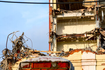 dismantled old building. Half demolished house, dismantling of the old one for the construction of...