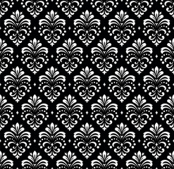 Floral pattern. Vintage wallpaper in the Baroque style. Seamless vector background. White and black ornament for fabric, wallpaper, packaging. Ornate Damask flower ornament