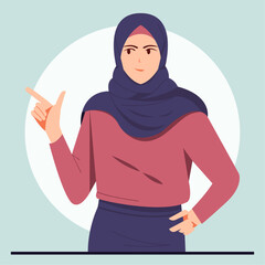 Young muslim woman wearing hijab pointing finger