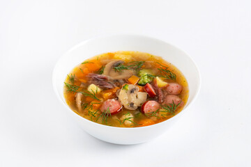 pot-au-feu vegetables sausage soup on the white