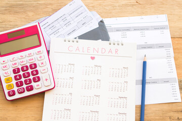 notebook planner, statement of bank business work arrangement flat lay style on background wooden