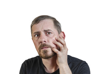 Portrait of an attractive bearded man of European appearance, with a slight gray hair, on an isolated white background. Holds a hand on the cheek. Expression of emotions of a man.