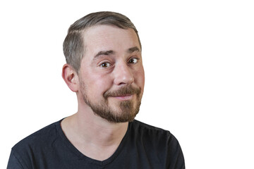 Obraz premium Portrait of an attractive bearded man of European appearance, with a slight gray hair, on an isolated white background. Naive facial expression. Expression of emotions of a man.