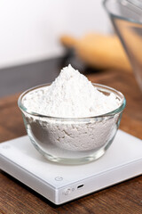 bowl of flour dough on a wooden surface. Cooking bread. Kneading the Dough. Long banner format