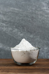 bowl of flour dough on a wooden surface. Cooking bread. Kneading the Dough. Long banner format