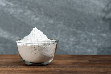 bowl of flour dough on a wooden surface. Cooking bread. Kneading the Dough. Long banner format