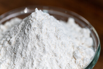 bowl of flour dough on a wooden surface. Cooking bread. Kneading the Dough. Long banner format