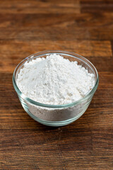 bowl of flour dough on a wooden surface. Cooking bread. Kneading the Dough. Long banner format